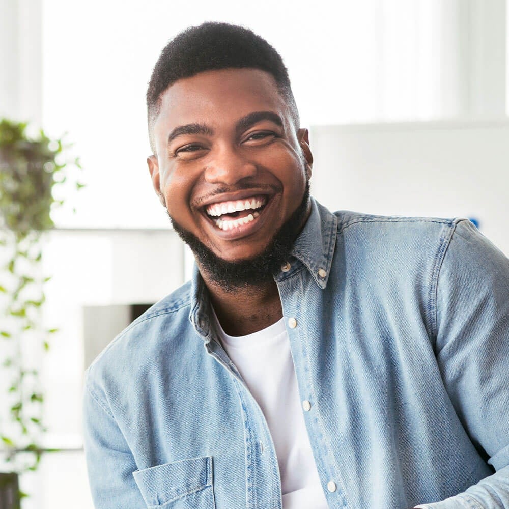 Young Adult Man with white teeth smiling